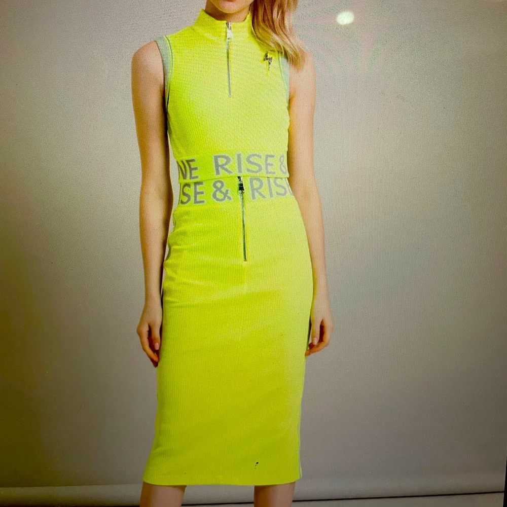 A beautiful pencil orange neon skirt with zippers on the front and back